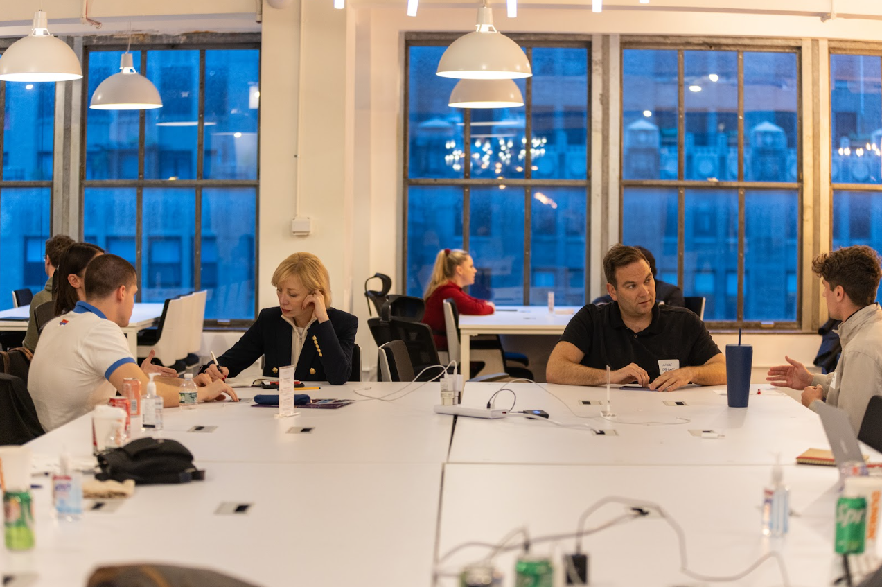 BOLD Fellowship participants collaborating in a modern office space during an entrepreneurship workshop in New York City.